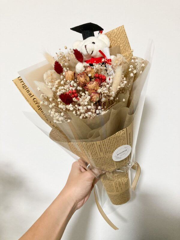 Dried rose bouquet with bear plush