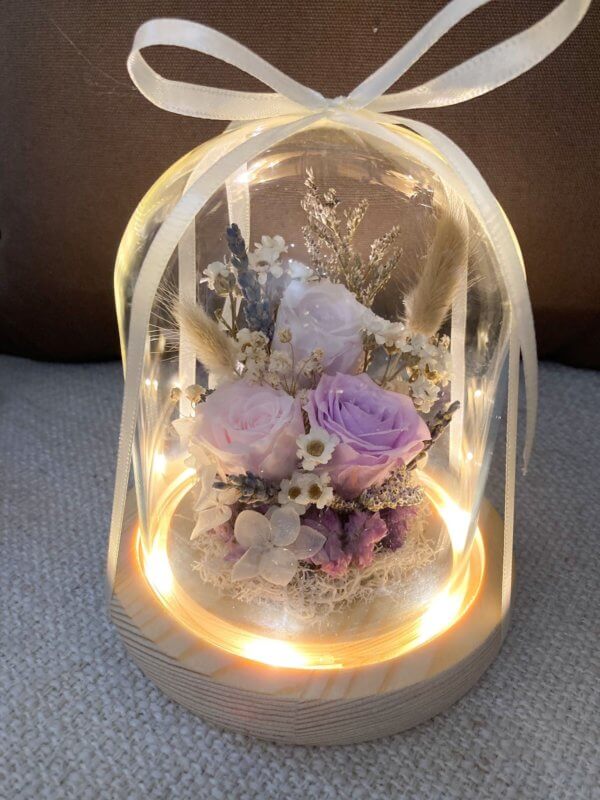 Ribbon wrapped flower dome with light